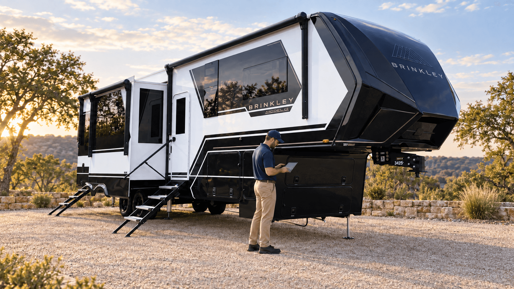 RV inspector documenting the exterior condition of a Brinkley fifth-wheel trailer